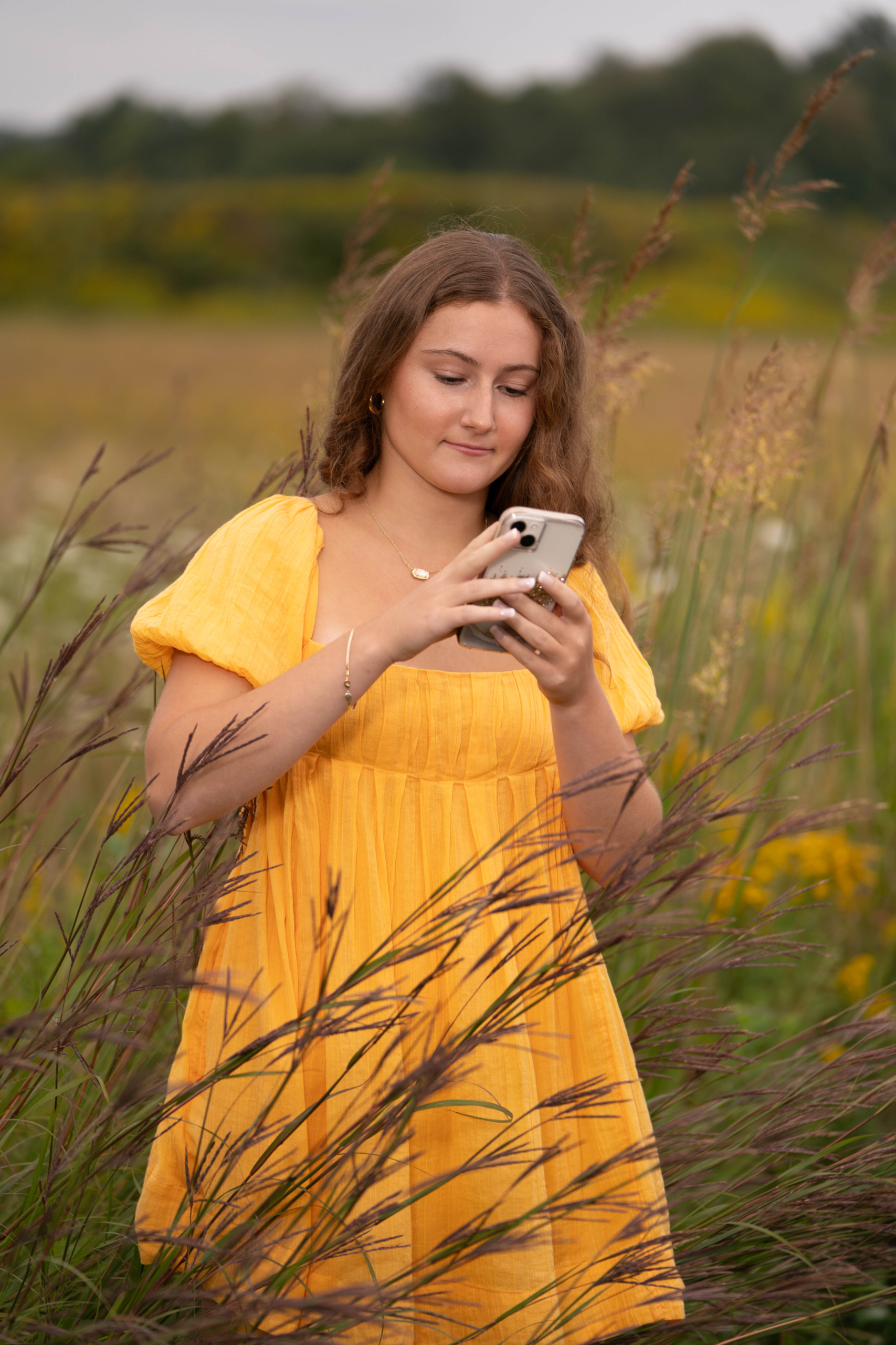 Sweet Studios Photography high school senior on cell phone